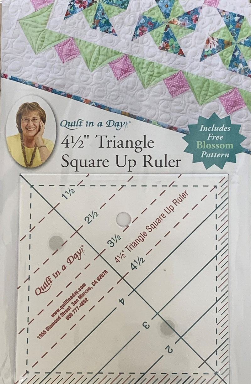 Quilt In A Day-Triangle Square Up Ruler. Easily square up triangles in seven sizes: 1.5in, 2in, 2.5in, 3in, 3.5in, 4in and 4.5in. This package contains one 4.5in x 4.5in triangle square up ruler and one free Blossom pattern