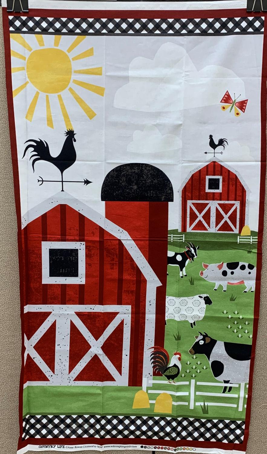 A big red barn is the focal point for this country life panel. Farm animals grazing in the grass while the bright sun shines above.