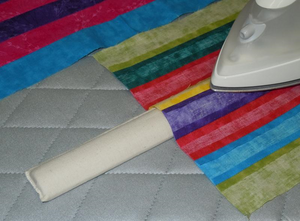 The Strip Stick, so-named for pressing seams when strip quilting, makes ironing seams a snap without distorting previously pressed seams. Other uses include the ability to press intricate piecing, such as one-block wonders and other blocks with intersecting seams.