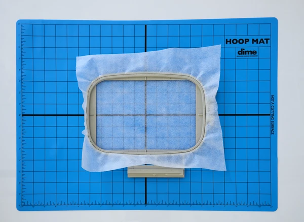 The Hoop Mat has non-slip surface holds hoop still during hooping. The mat has printed grid aids in accurate placement of embroidery designs. Size = 16