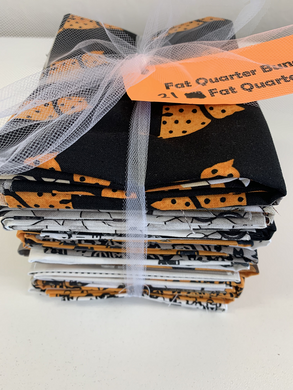 A fun group of Halloween fat quarters with cats, sewing accessories, mannequins and more.