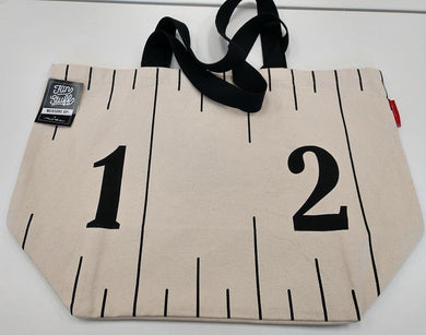 A fun grocery bag size tote with a large measuring tape across the bag.