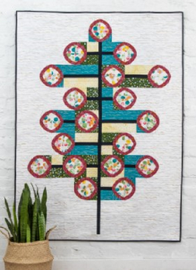 This modern design from Sew Kind of Wonderful would be a great addition to any contemporary living space. This pattern uses the Quick Curve Mini Ruler.